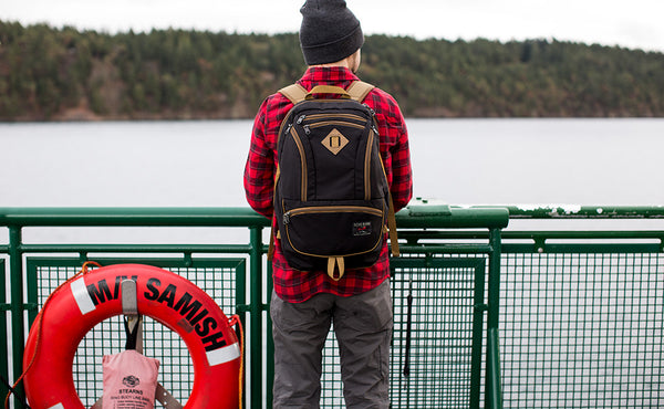 A person on a ferry wearing the Guide's Edition Synapse 25.